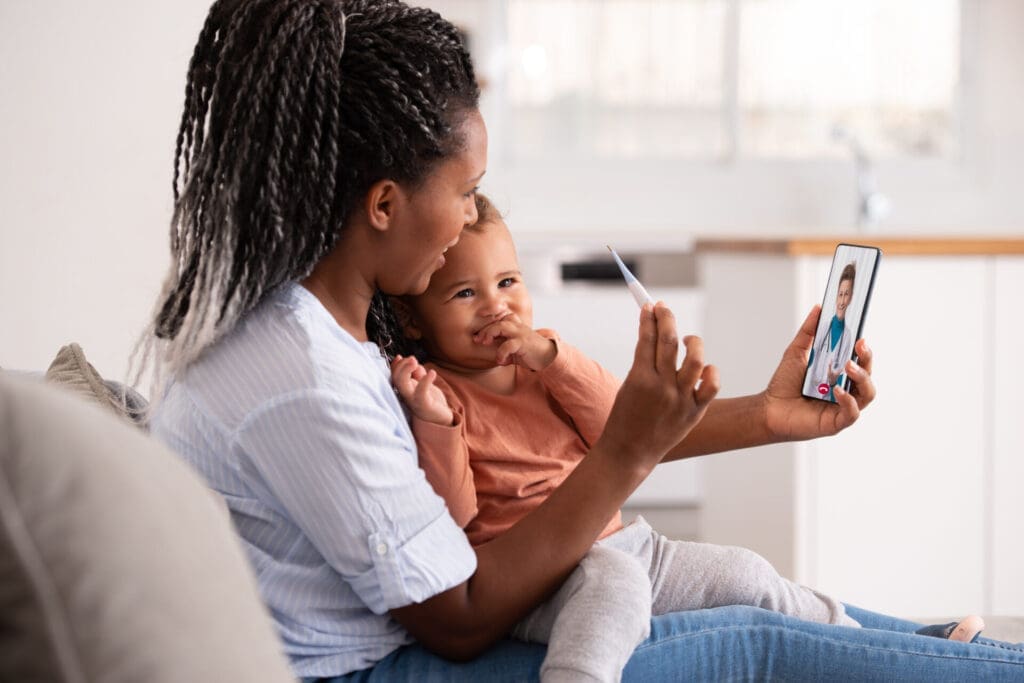 woman with child having a telehealth visit