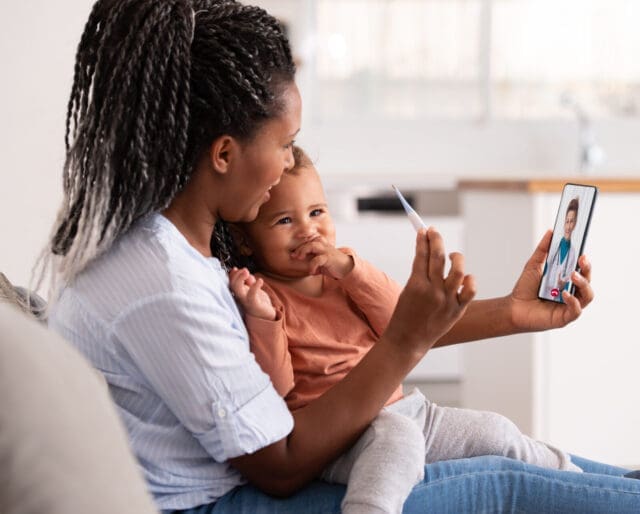 woman with child having a telehealth visit