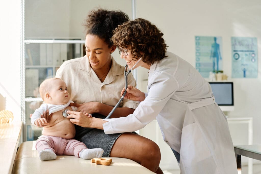 Mother and baby with pediatrician
