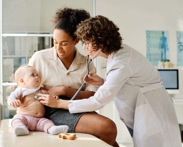 Mother and baby with pediatrician