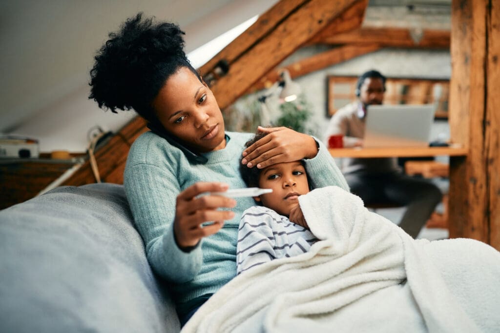 Mother taking care of a child with a fever