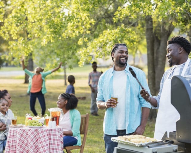Large family BBQing at a picnic