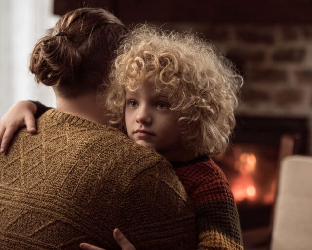 Father consoling sad little boy